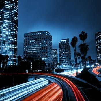 Colorful city with fast traffic at night