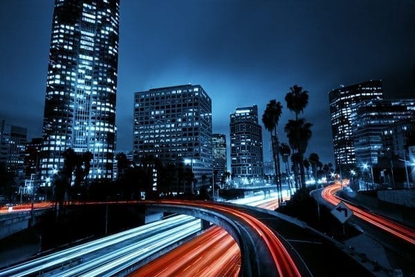 Colorful city with fast traffic at night