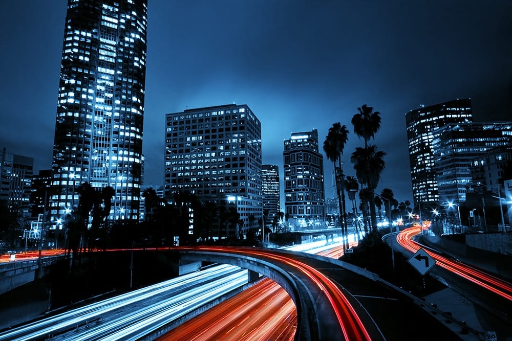 Colorful city with fast traffic at night