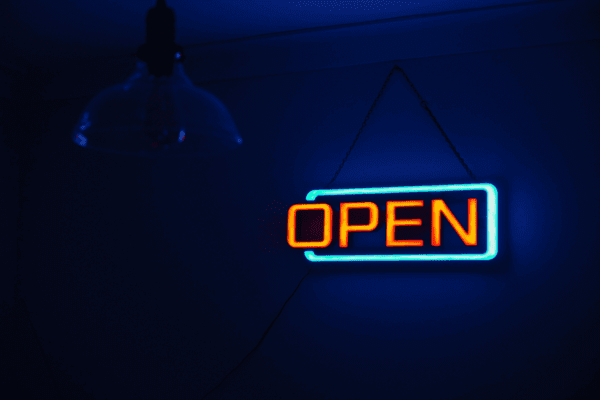 Open sign glowing in dark – Imagine Monkey Orange County web design blog